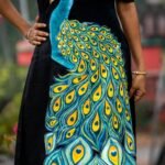 Close-up shot showing intricate hand painted 3D peacock feather details on a black cotton dress