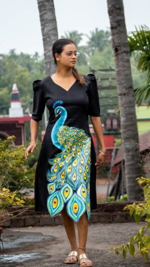 Full-length shot of a woman walking outdoors in a hand painted 3D peacock black midi dress