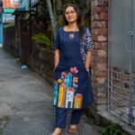 Navy blue hand-painted pure cotton co-ord set featuring a colorful cityscape motif and straight trousers.