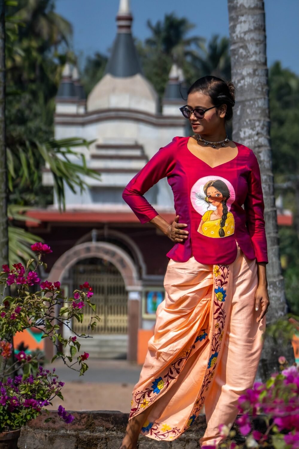 Full-length pose showing the draped silhouette of the Nayantara hand-painted magenta top and peach dhoti pant set