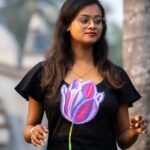 Detailed view of purple 3D handpainted tulip motif on black Malai Cotton dress