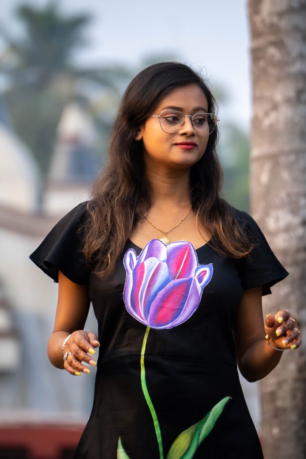 Detailed view of purple 3D handpainted tulip motif on black Malai Cotton dress