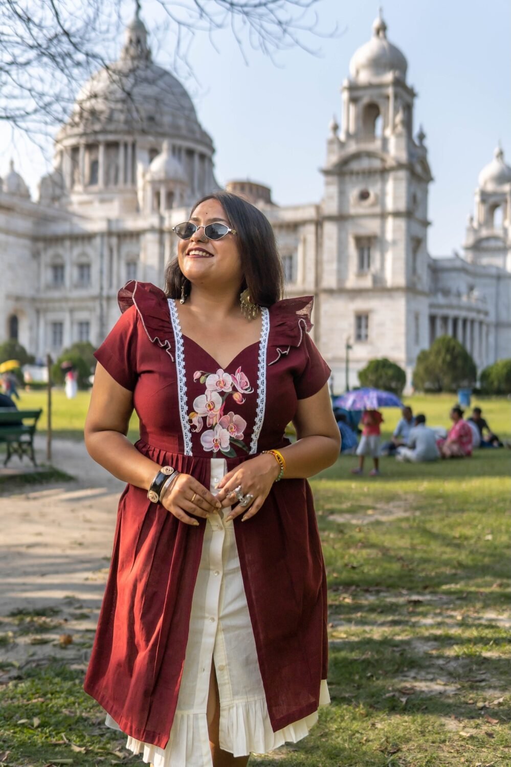 Model wearing Mridu hand-painted maroon and off-white layered cotton dress.