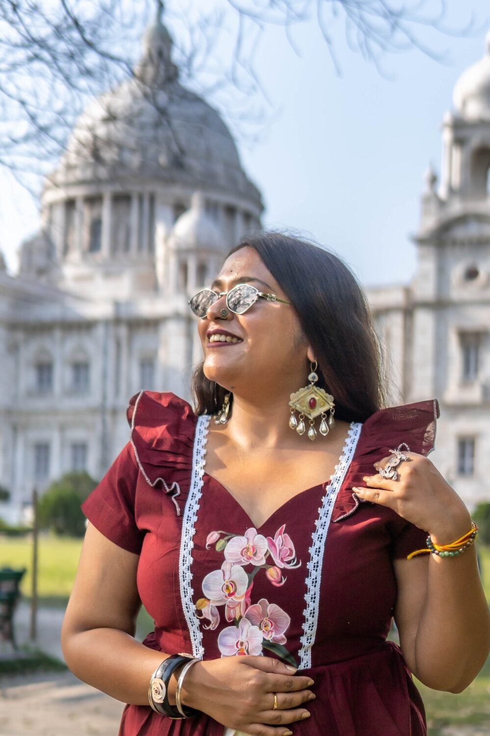 Side angle view showing flutter sleeves and white lace details on Mridu cotton dress.