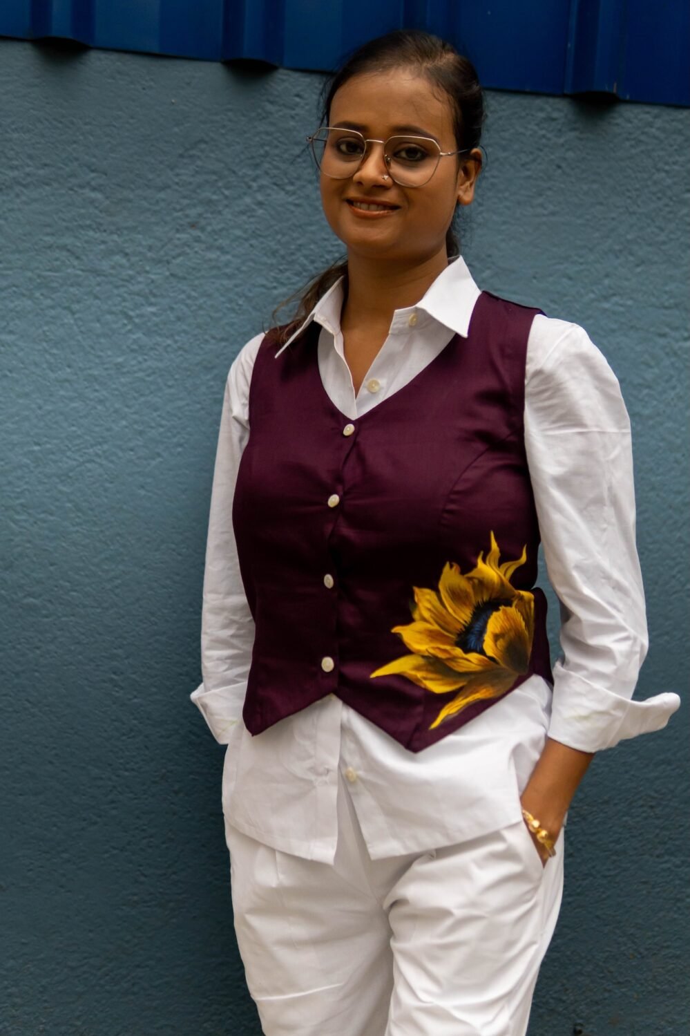 Front portrait showing a purple handpainted sunflower waist coat by Aankibukis Couture layered over a formal white shirt.