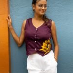Front view of a woman wearing Aankibukis Couture purple handpainted sunflower waist coat without a inner layer.