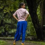 Full back view of woman wearing CharuNeela royal blue dhoti and beige layering jacket