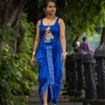 Model walking in CharuNeela hand painted 2-piece royal blue dhoti set