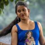 Close-up of royal blue hand painted crop blouse featuring female portrait art by Aankibukis Couture