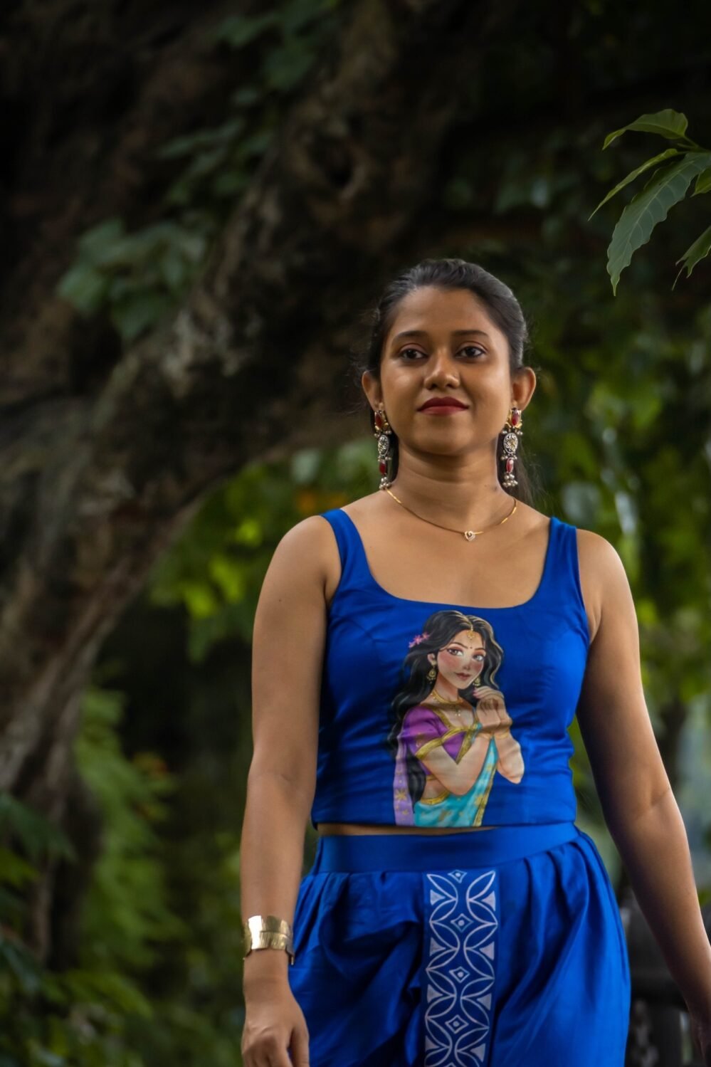 front view of royal blue hand painted bustier blouse paired with dhoti