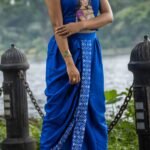 Detailed view of ready to wear royal blue dhoti with hand painted kalka motif border