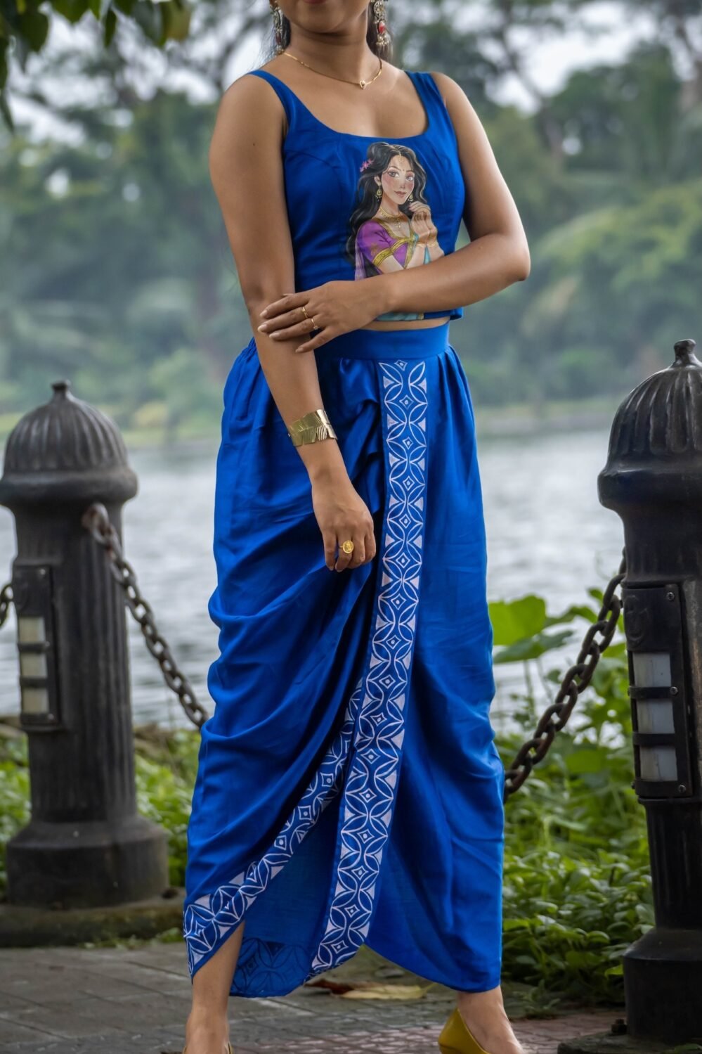 Detailed view of ready to wear royal blue dhoti with hand painted kalka motif border