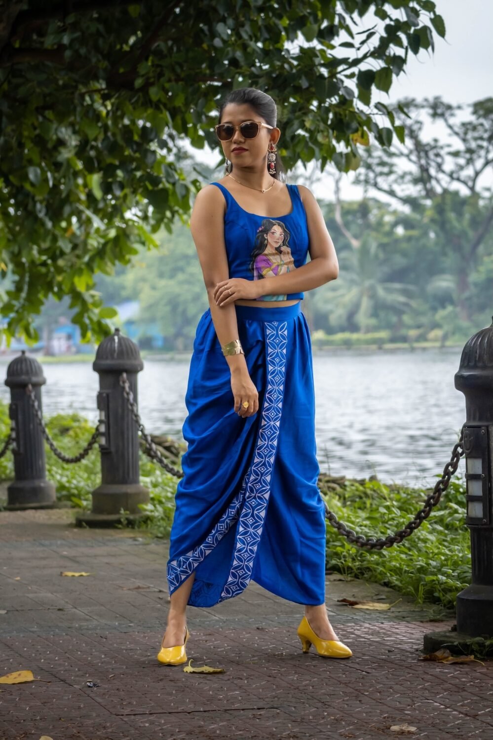 Full-length view of woman wearing CharuNeela royal blue pre-draped dhoti and hand painted blouse