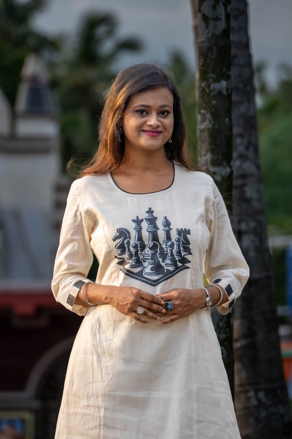 Portrait mode capture of women wearing handpainted chess co-ord
