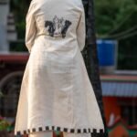 Full Rear view of white Kora Khadi co-ord set featuring handpainted chess piece artwork on the back