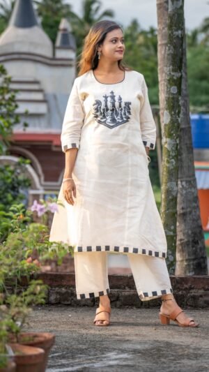 Woman wearing white handpainted Kora Khadi chess co-ord set with black checkered trims by Aankibukis Couture