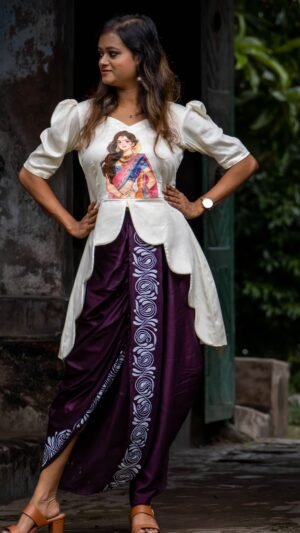 Woman wearing hand painted off-off-white top and Magenta dhoti co-ord set by Aankibukis Couture.