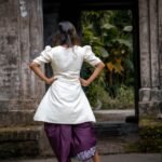 Full-length pose from back side displaying the complete fusion outfit paired with block heels.