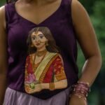 Close-up detail of the hand-painted Maa Durga Kalyani portrait on the purple top.