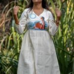 Woman posing outdoors wearing off-white handpainted Kora Moon Light Co-ord set with pants by Aankibukis Couture