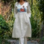 Off-white handpainted kora khadi co-ord set worn with brown heels for a daily outing style.