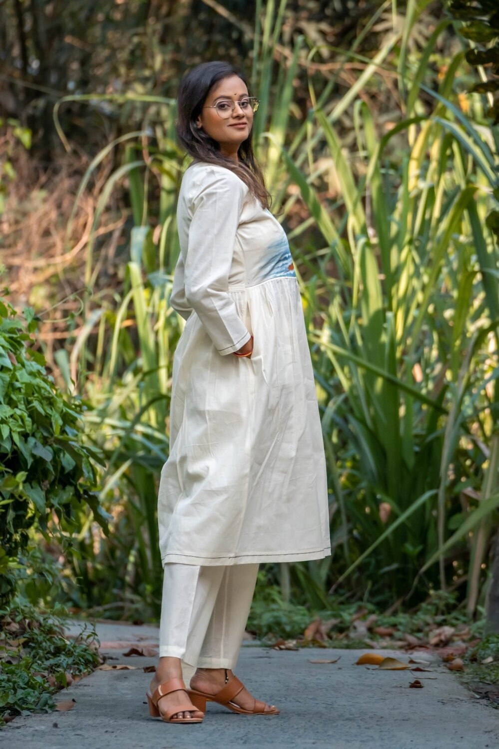 Side profile of woman wearing Kora Moon Light Co-ord set with hands in practical side pockets.