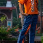 Blue cotton lava concept pants with orange side panels paired with handpainted khadi shirt.
