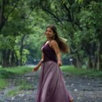 Outdoor shoot of a model twirling in the Kalyani flowy lehanga skirt by Aankibukis Couture.