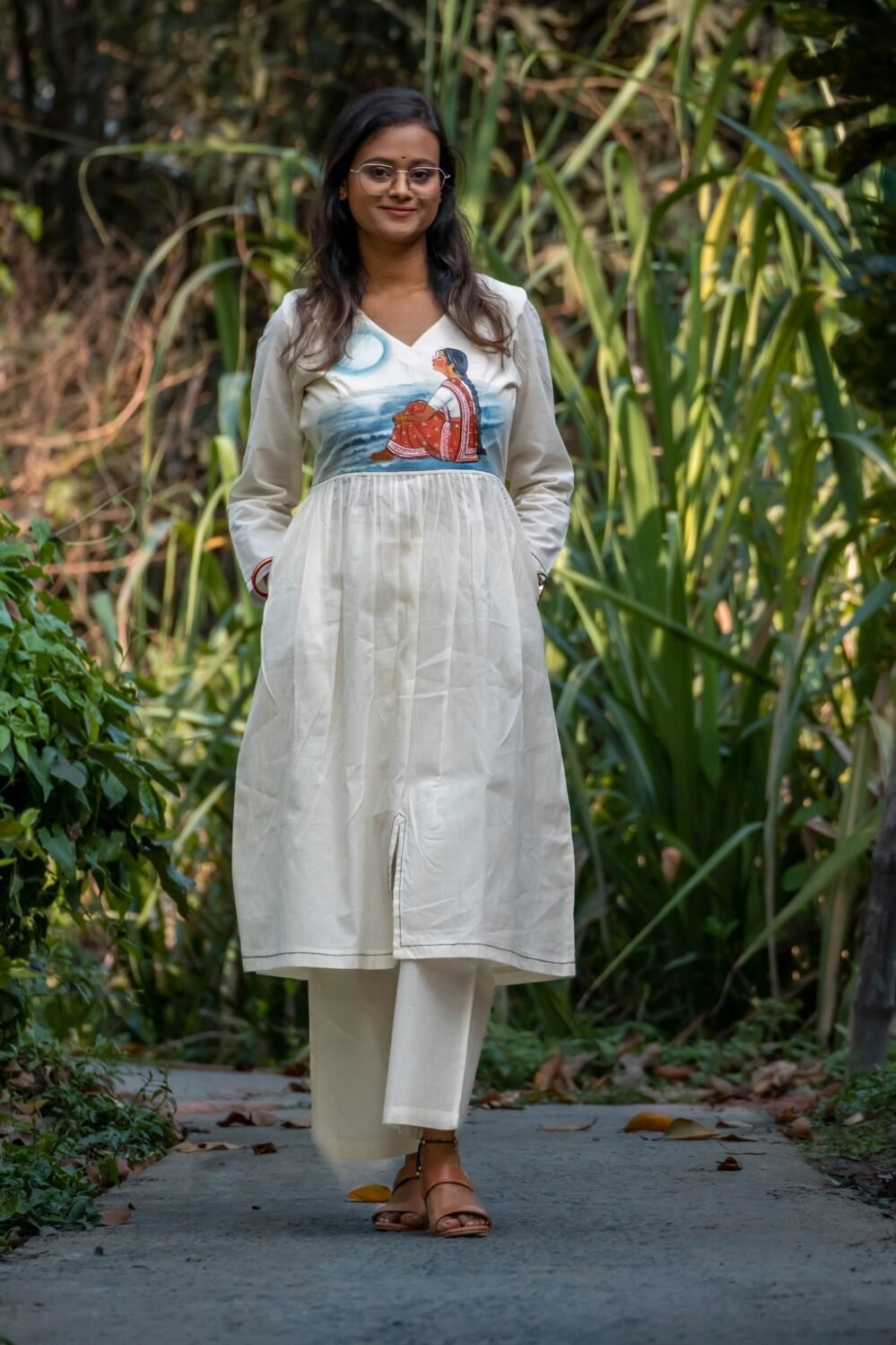 Full-length front view of handpainted off-white kora khadi tunic and matching straight pants set.