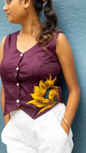 Three-quarter view of a woman styled in a deep purple handpainted sunflower Malai cotton waist coat.