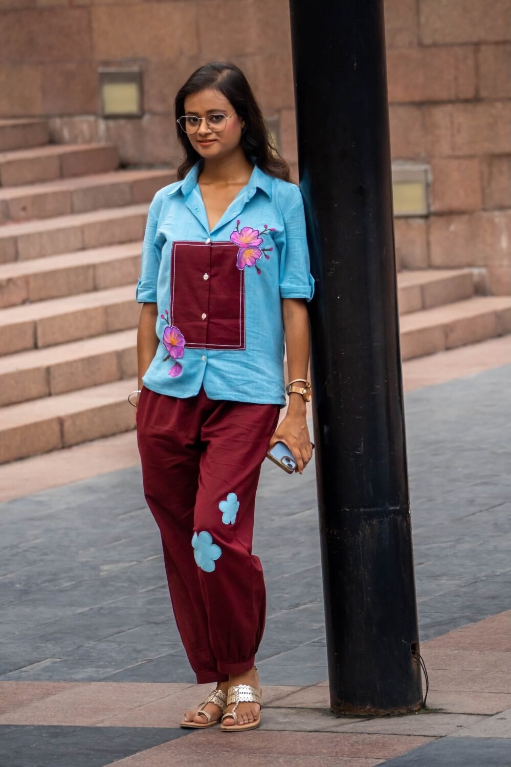 Woman showcasing the Sky Blue Maroon Orchid 3D handpainted co-ord set in an urban outdoor setting.