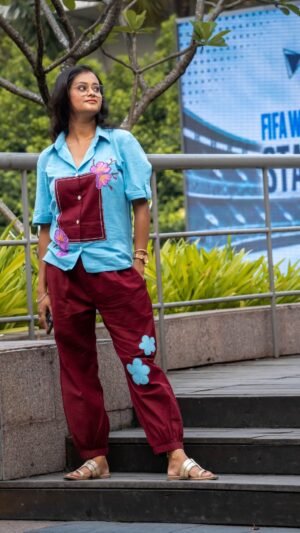 Full-length side view of the Sky Blue Maroon Orchid co-ord set highlighting the blue flower patch on the maroon pants.
