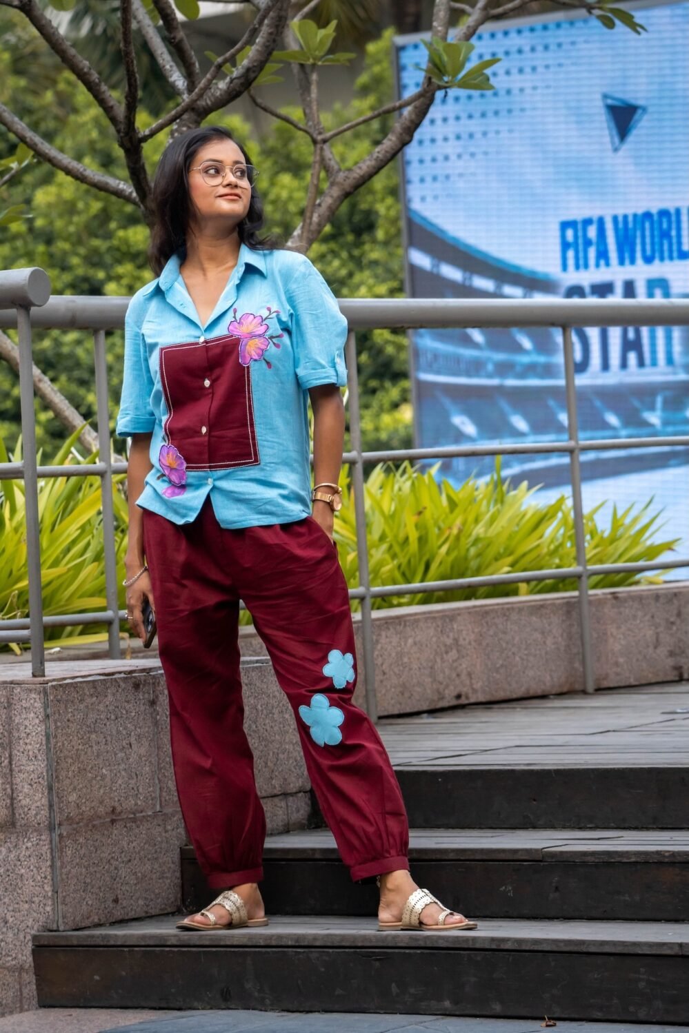 Full-length side view of the Sky Blue Maroon Orchid co-ord set highlighting the blue flower patch on the maroon pants.