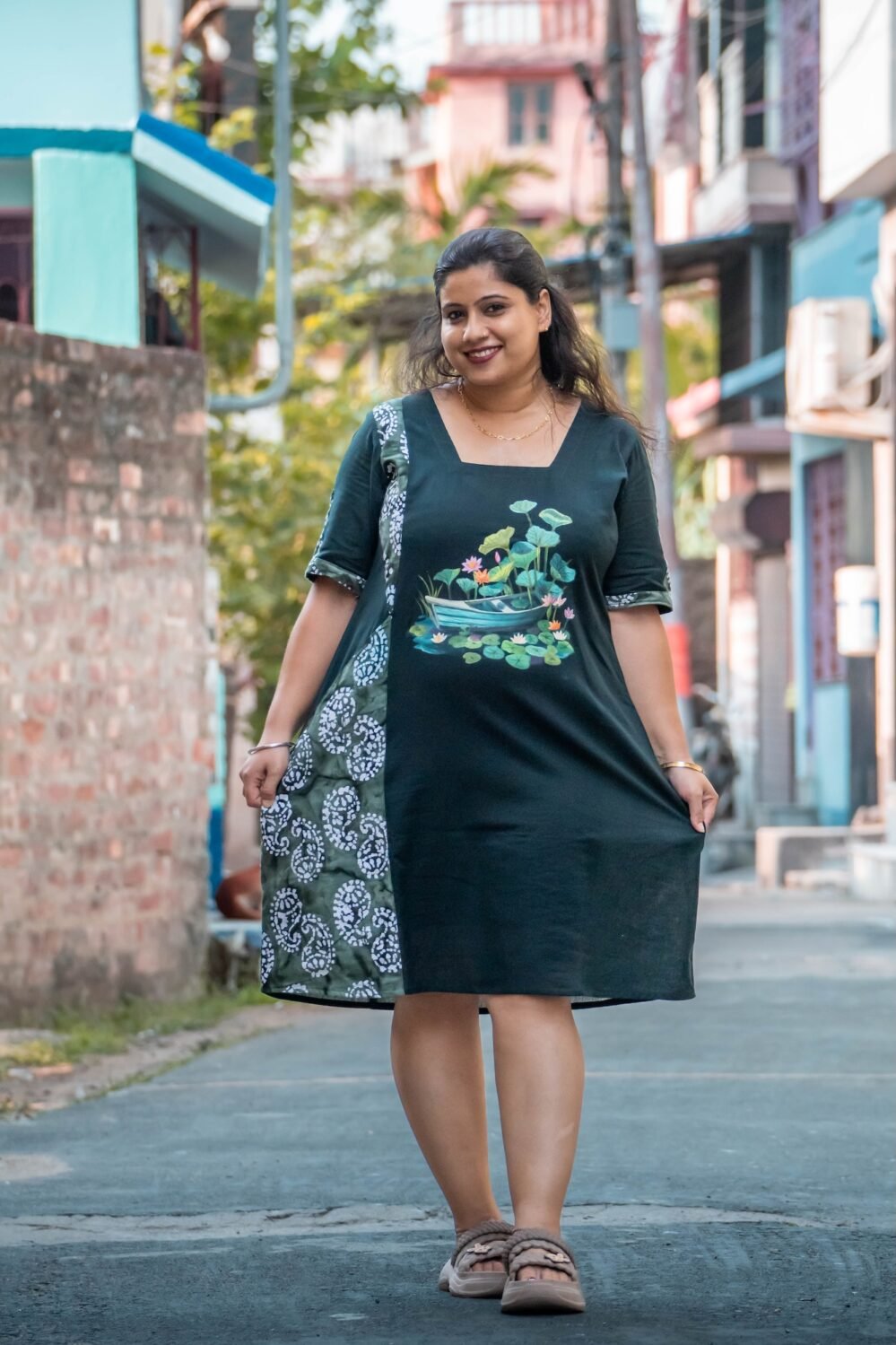 women showing dress details in the middle of a road
