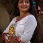ortrait of a woman showcasing the hand-painted Maa Durga artwork on the bodice of the Annapurna dress.