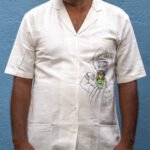 Man wearing off-white Kathakali handpainted handwoven cotton shirt with blazer collar by Aankibukis Couture