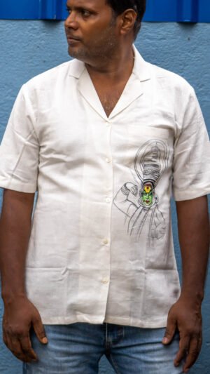 Man wearing off-white Kathakali handpainted handwoven cotton shirt with blazer collar by Aankibukis Couture