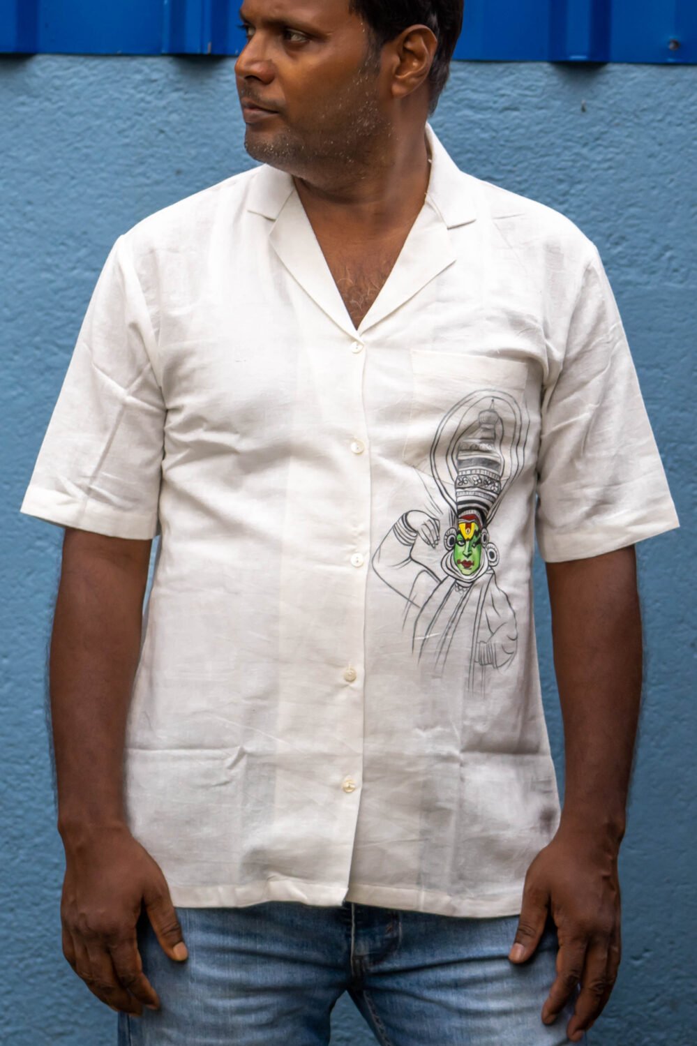Man wearing off-white Kathakali handpainted handwoven cotton shirt with blazer collar by Aankibukis Couture