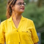 Upper body view highlighting the smart blazer collar and breast pocket on yellow cotton shirt.