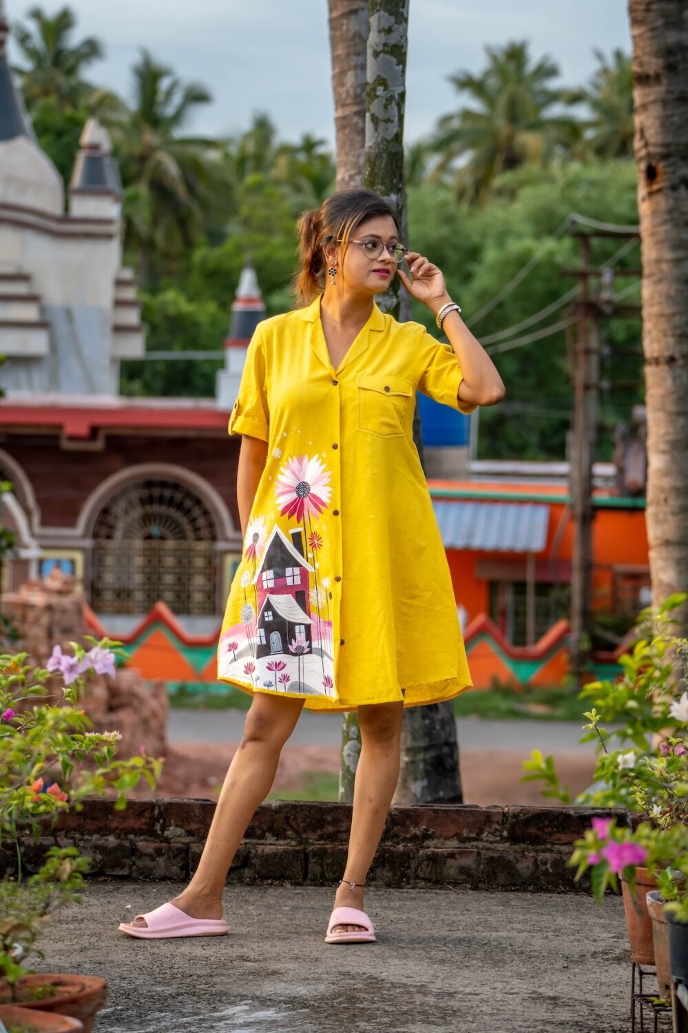Model standing full-length in yellow hand-painted storybook cottage shirt and short set.