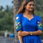 Close-up of the sweetheart neck bodice and hand-painted tulip sleeves on a royal blue dress.